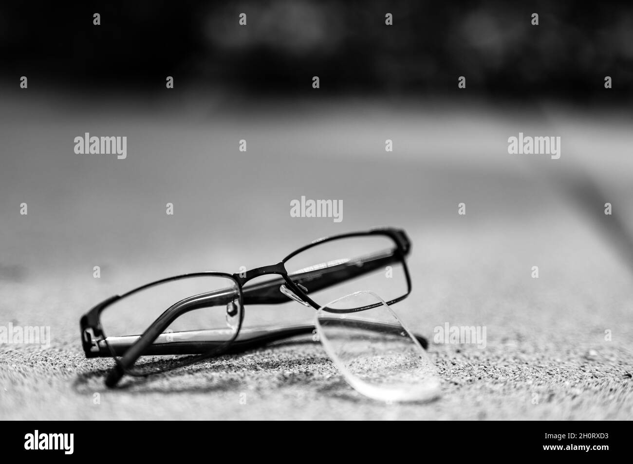 Selective focus on damaged glasses with scratched lens popped out Stock