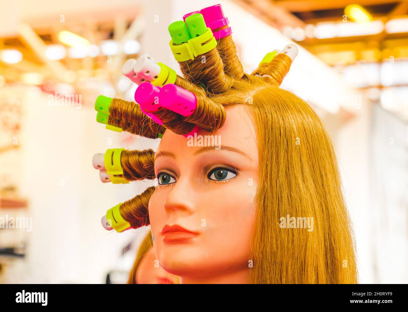 curlers wig hairdresser face background hairdresser curlers and curlers on wig Stock Photo