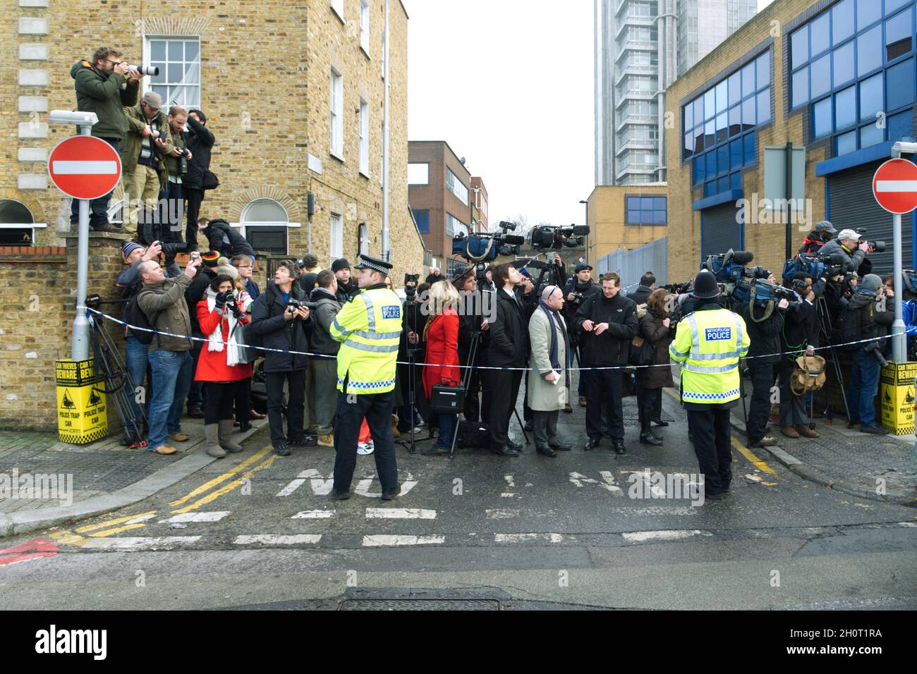 Group of Press and Media Reporters Behind a Police Cordon Stock Photo