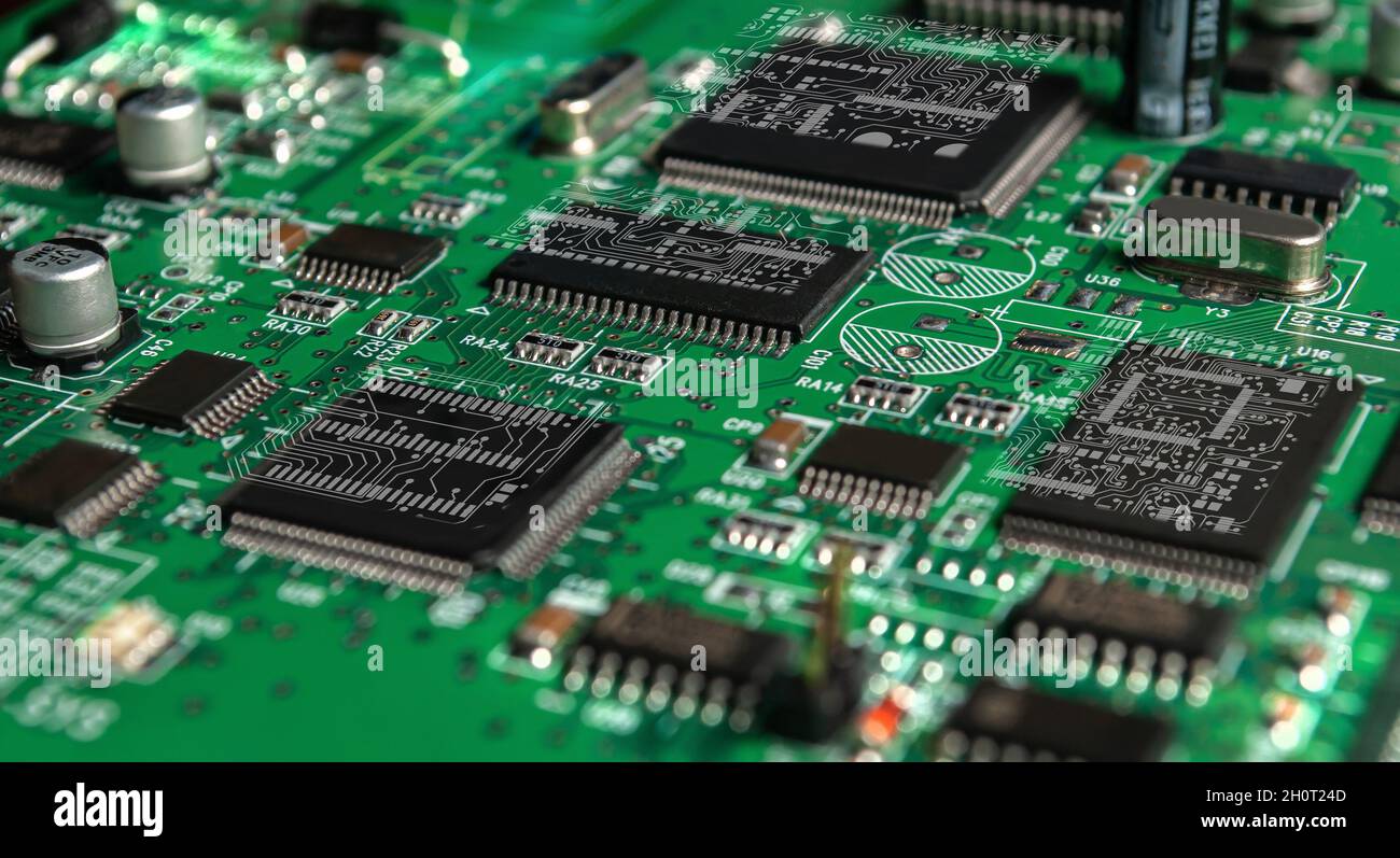 printed circuit board with surface mounted passive and active circuit components close up Stock Photo
