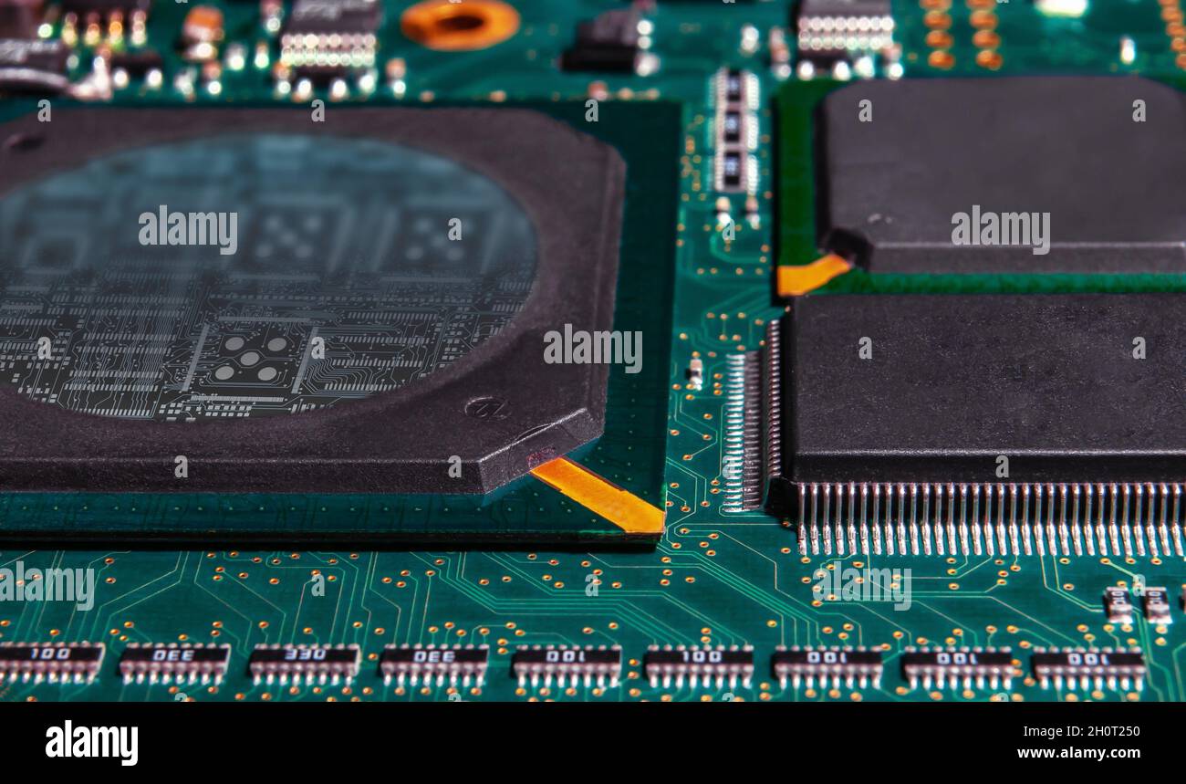 printed circuit board with surface mounted passive and active circuit components close up Stock Photo