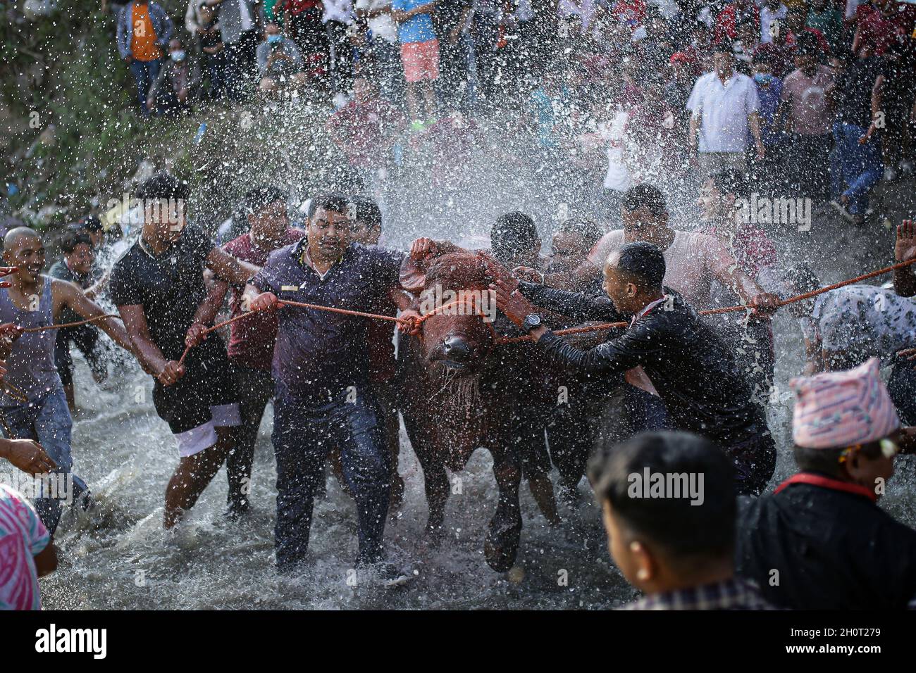 Bhaktapur, Bagmati, Nepal. 14th Oct, 2021. Nepali Hindu devotees splash