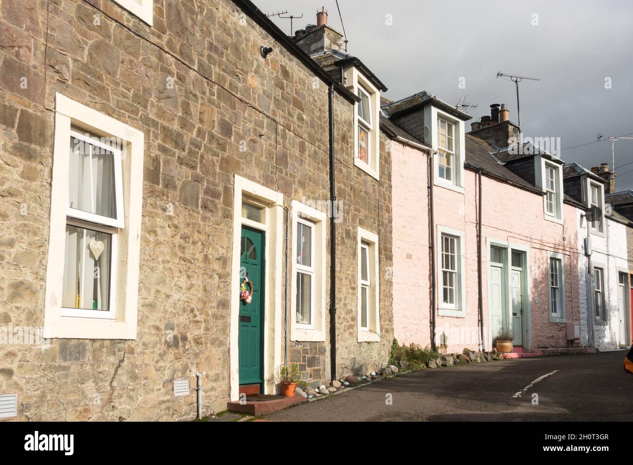 A row of stone built and painted houses in Moffat, Dumfriesshire, Scotland, UK Stock Photo