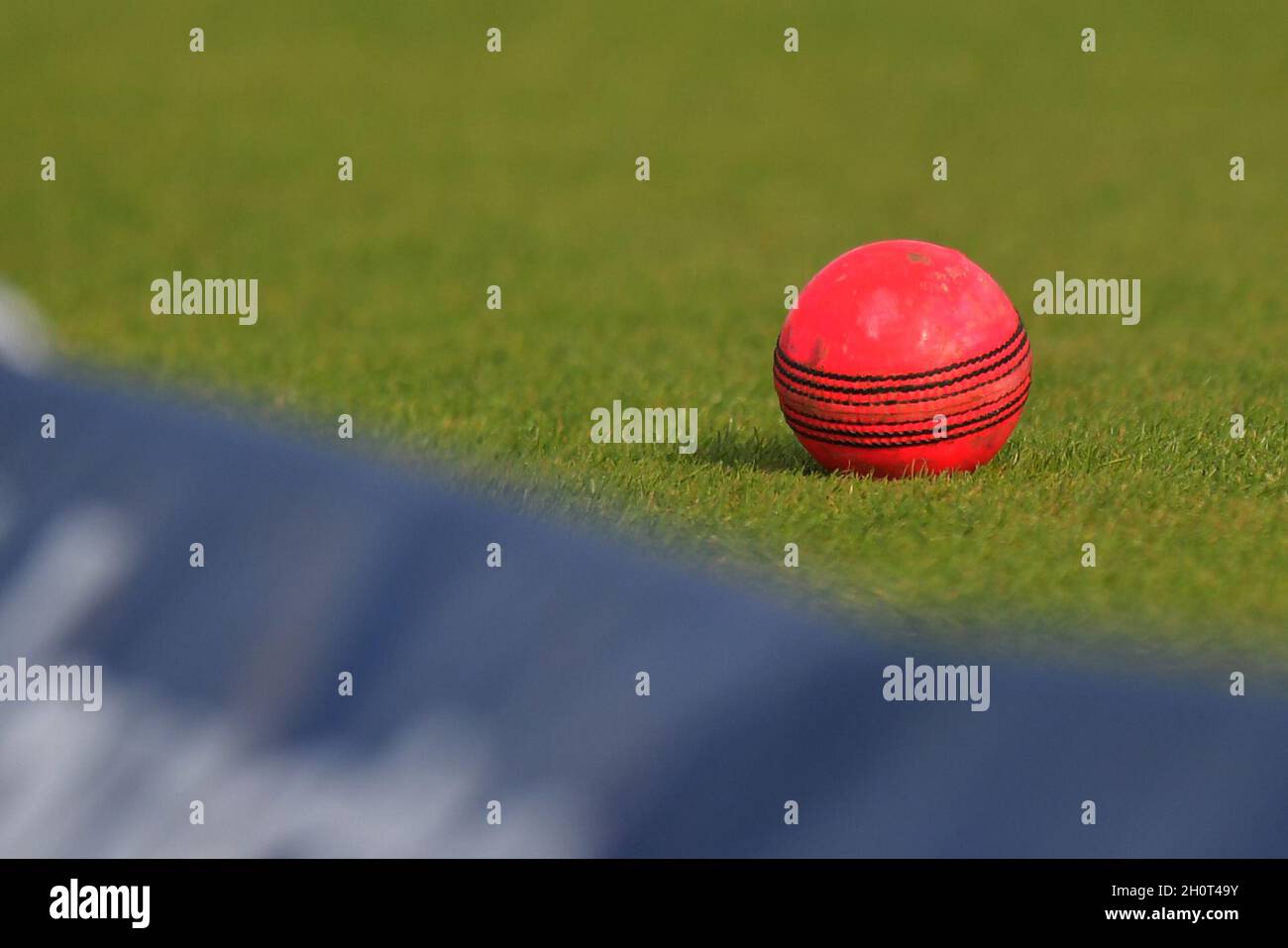 The pink ball lies near the boundary during the first Invested Test Match between England and the West Indies at Edgbaston cricket ground, Birmingham. Picture date: Thursday August 17, 2017. Photo credit should read: Anthony Devlin/Empics Contributor Stock Photo
