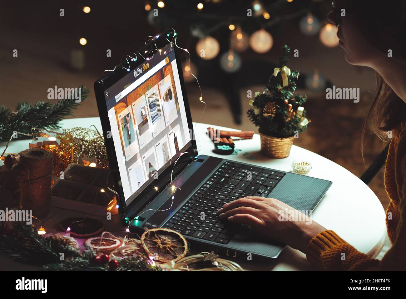 young woman with laptop over christmas tree background Stock Photo