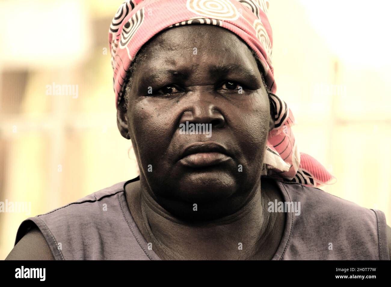 When Boko Haram invaded her village, they set houses ablaze. 60 year old Zaratu Marcus fled from her home, Gava in Gwoza, but left behind in panic her husband, whom had a mental illness. Some villagers told her that her husband was burnt alive in the house but other people claimed he was shot dead. Zaratu eventually escaped from Gava to Adamawa with her nine children, who live as displaced persons at the Damari camp along Girei road in Adamawa. Stock Photo