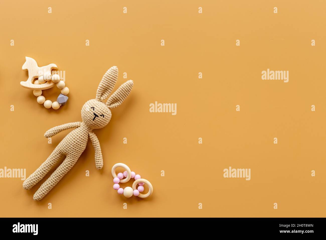 Baby toy rabbit with wooden accessories, overhead view Stock Photo - Alamy