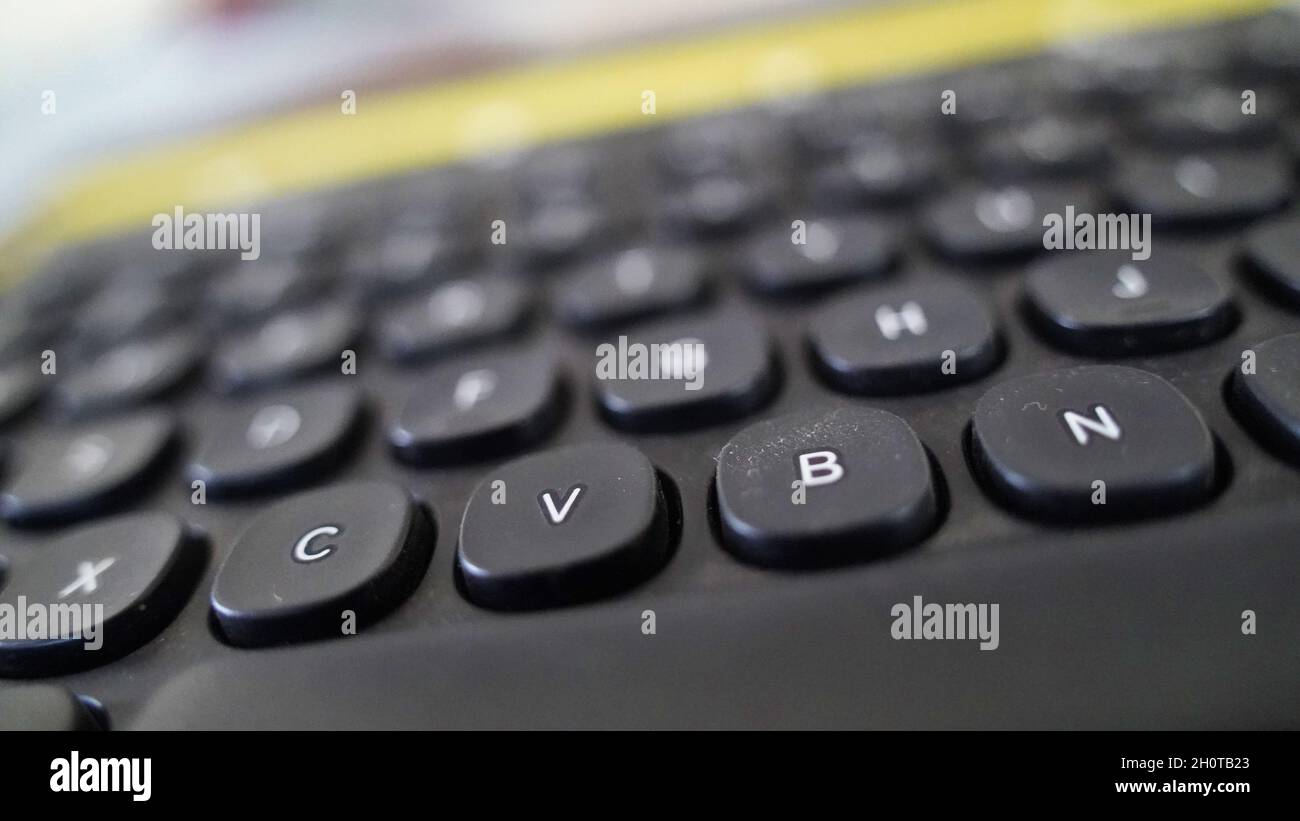 Black computer keyboard , Realistic buttons layout of laptop isolated on black background. Stock Photo