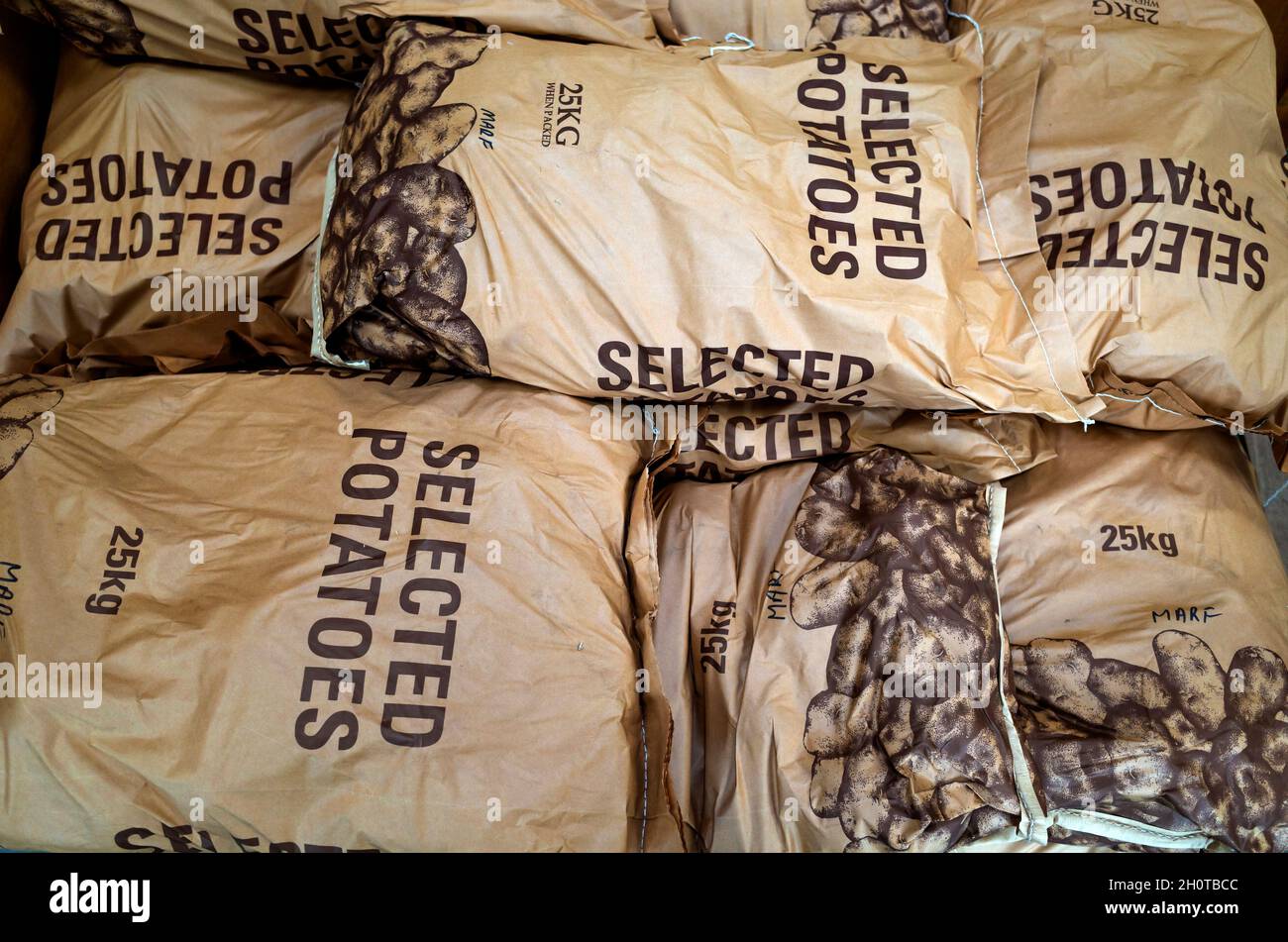English potatoes in 25kg bags for sale priced at £25 in a Yorkshire farm shop October 2021 Stock Photo