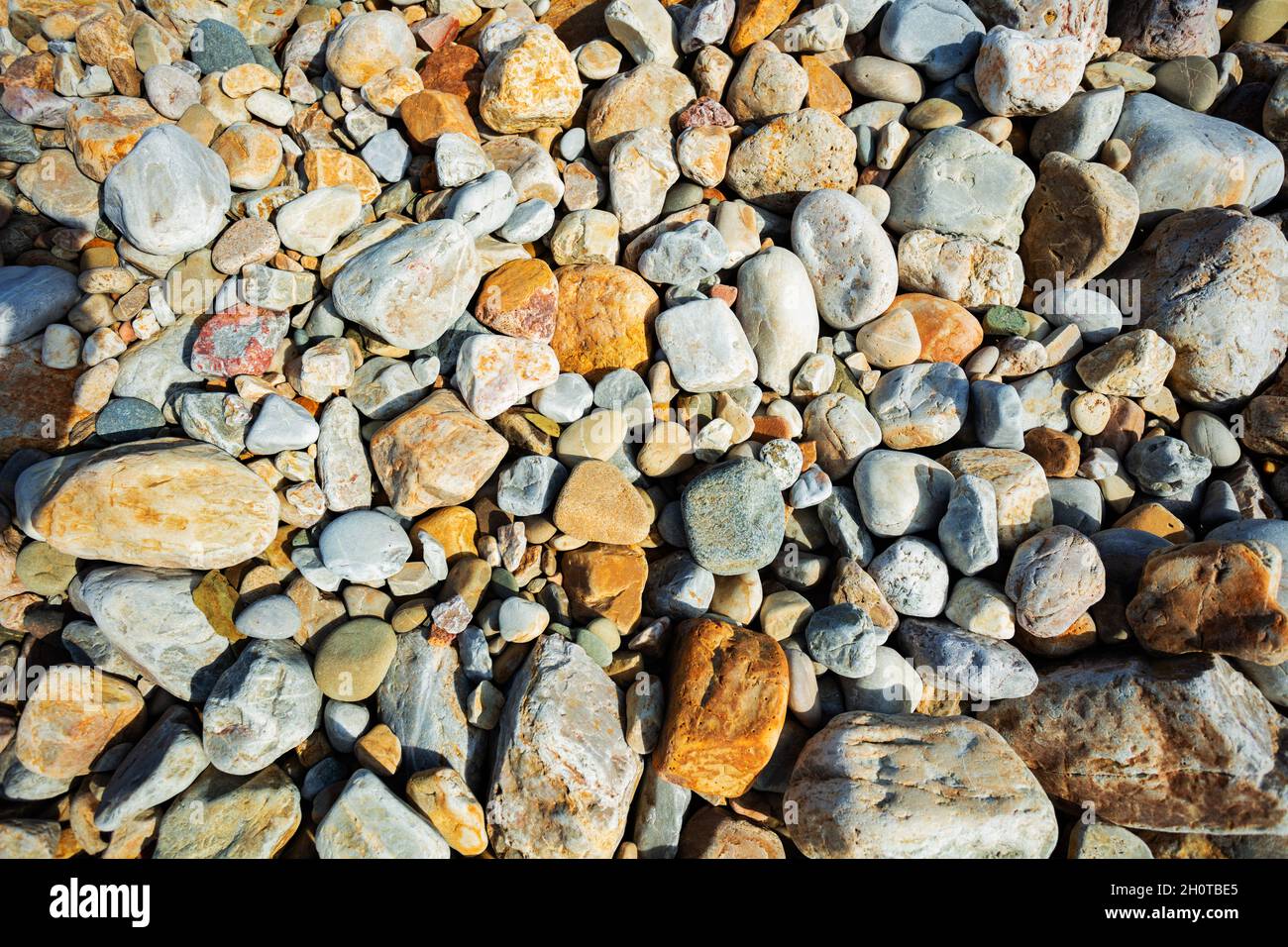 Closeup of sea stones pebbles and rocks background Stock Photo - Alamy