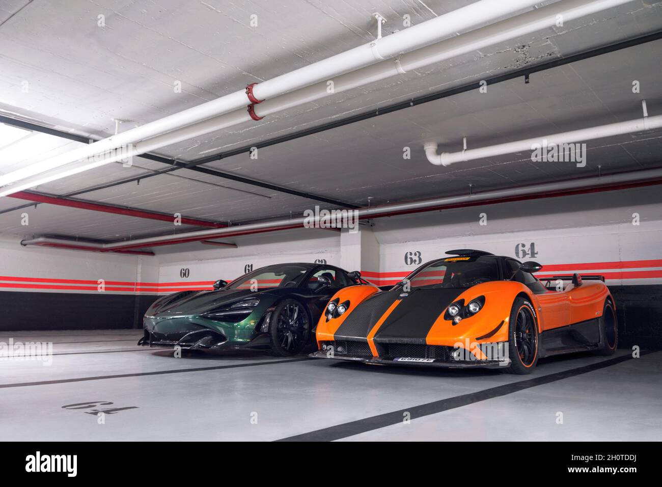 Orange Pagani Zonda Cinque and green McLaren 720S TopCar supercars on an  underground car park in central Geneva, Switzerland Stock Photo - Alamy