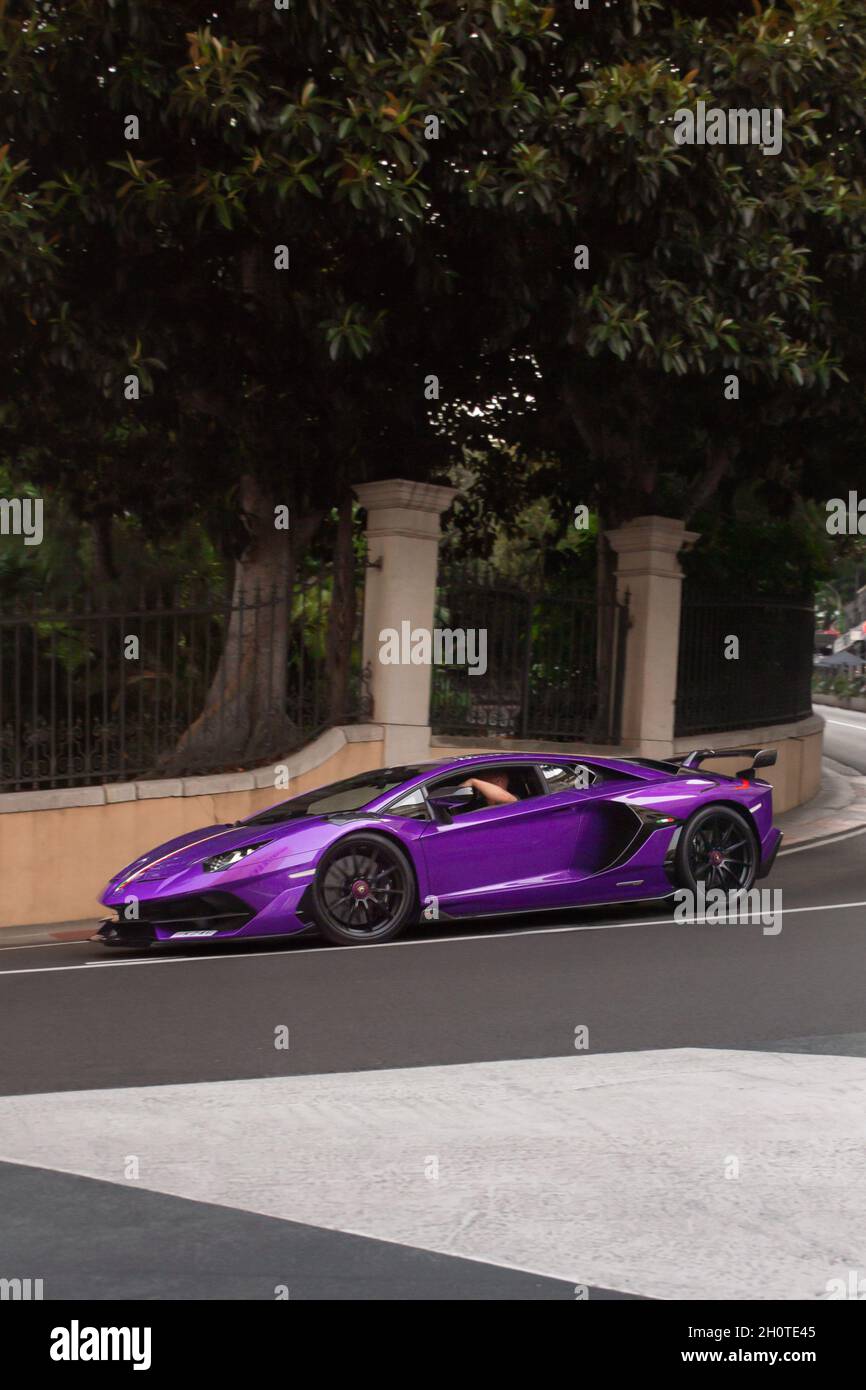 Purple Lamborghini Aventador SVJ supercar driven on a street in central  Monaco, part of the F1 circuit Stock Photo - Alamy