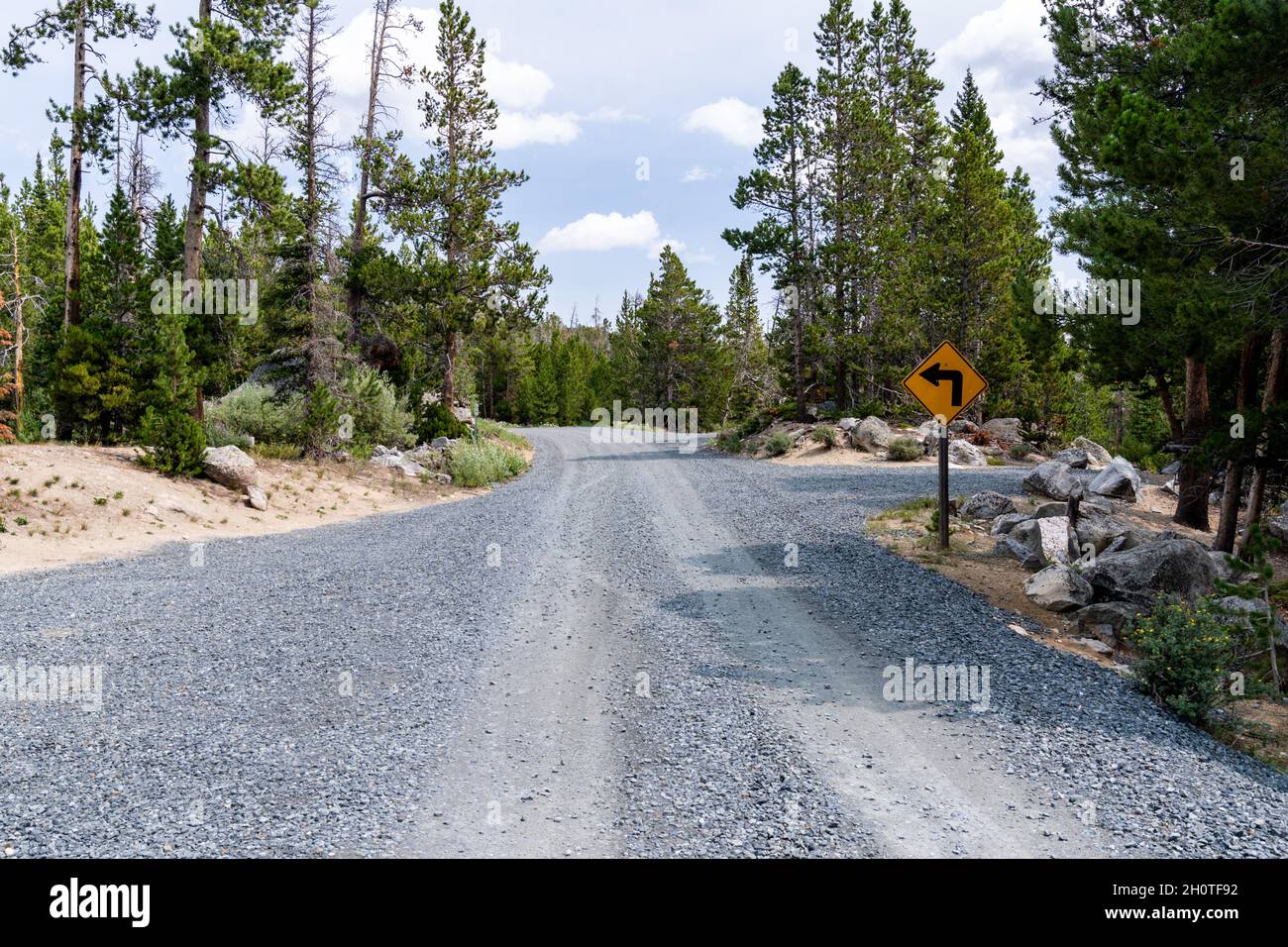 Newly graded gravel road near Fiddlers Lake and the Little Popo Agie River outside of Lander, Wyoming Stock Photo