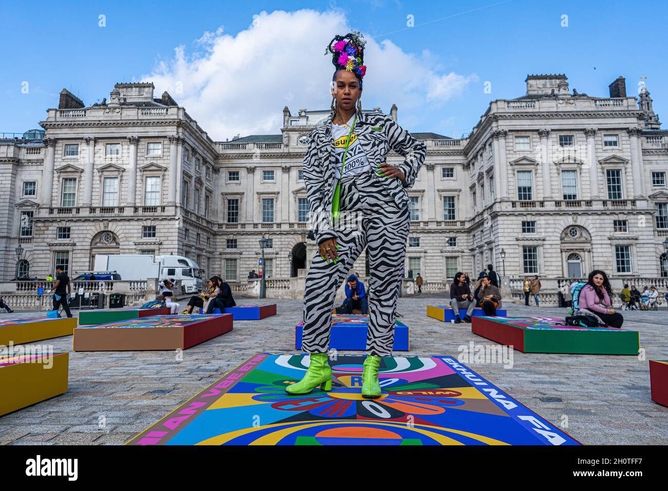 Lakwena Maciver poses with her works Basketball Paintings (2021) at