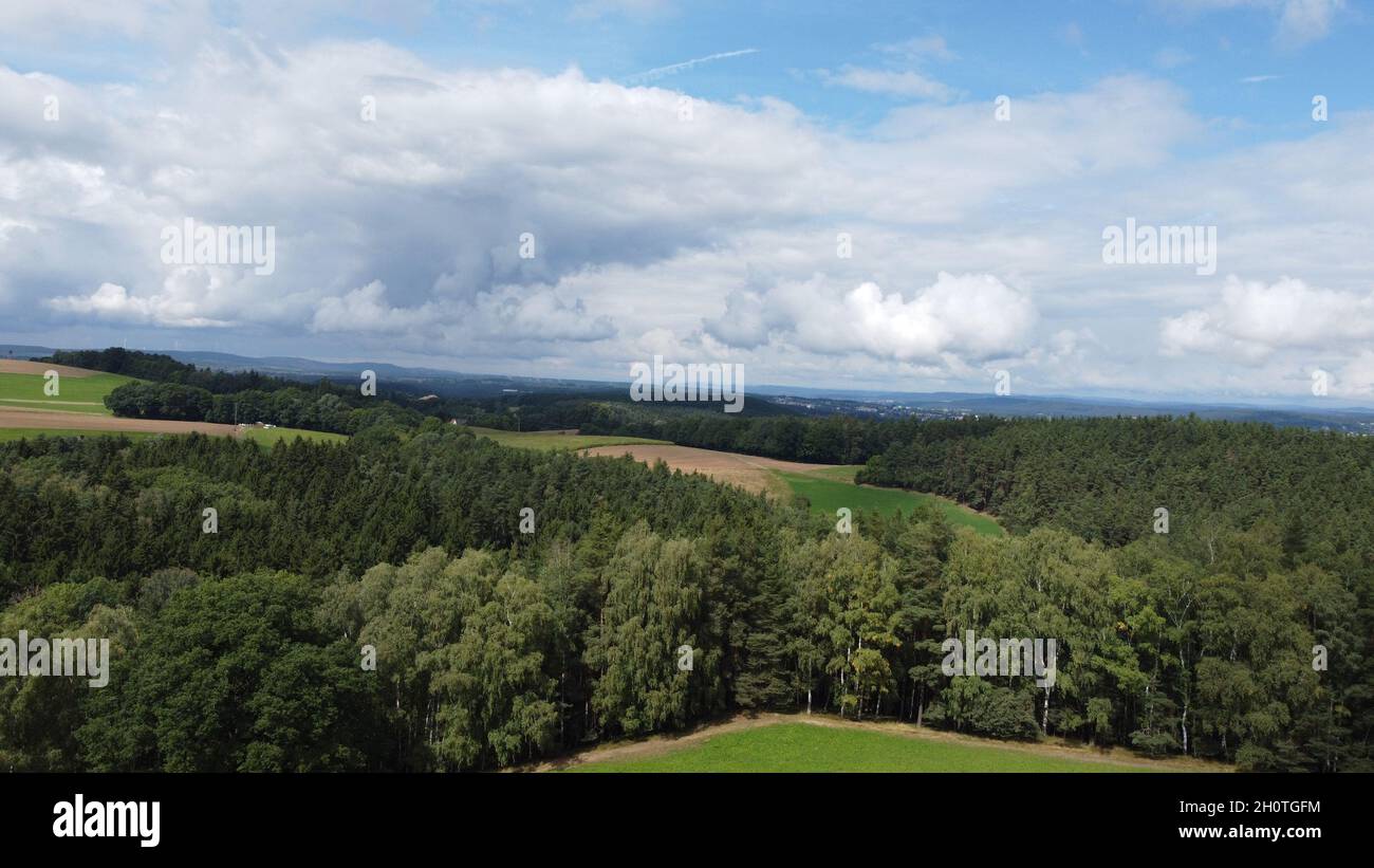 Beautiful landscape of a hill with the forest under the blue sky Stock ...