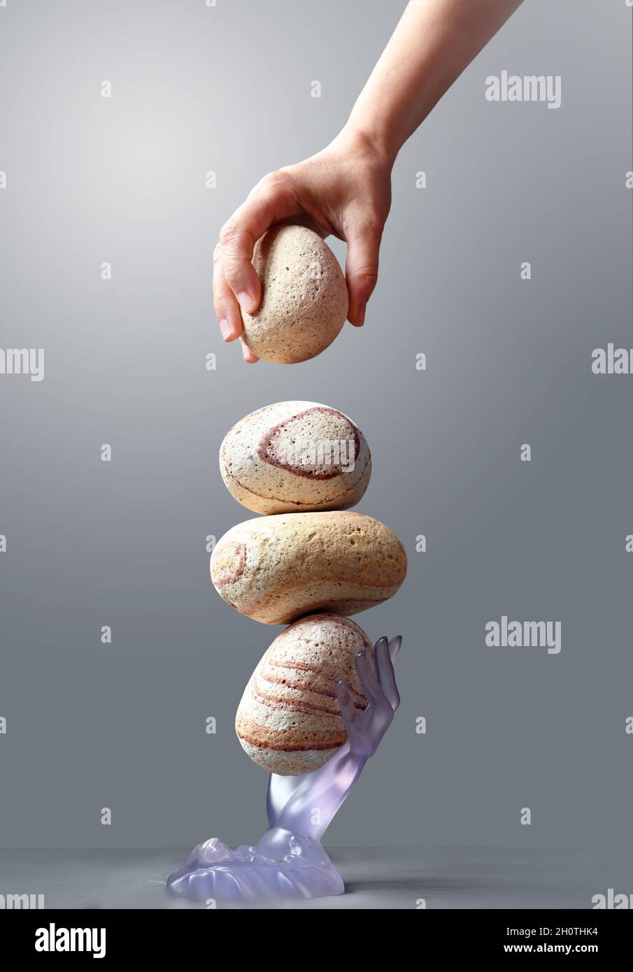 Hand Finished Stone Tower. Hand Setting Natural Pebble Stone. Balancing