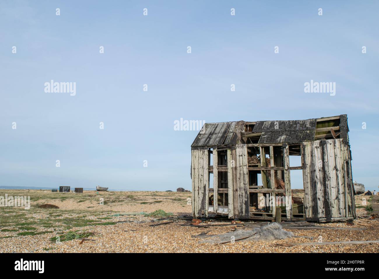 Abandoned and damaged wooden fishing shed at the beach of Dungeness ...