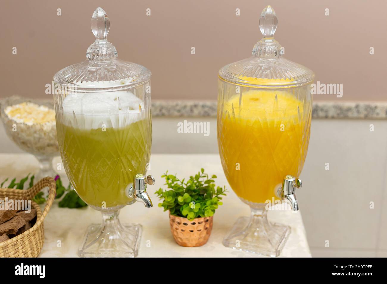 Juice in large glass bottle with small tap Stock Photo - Alamy