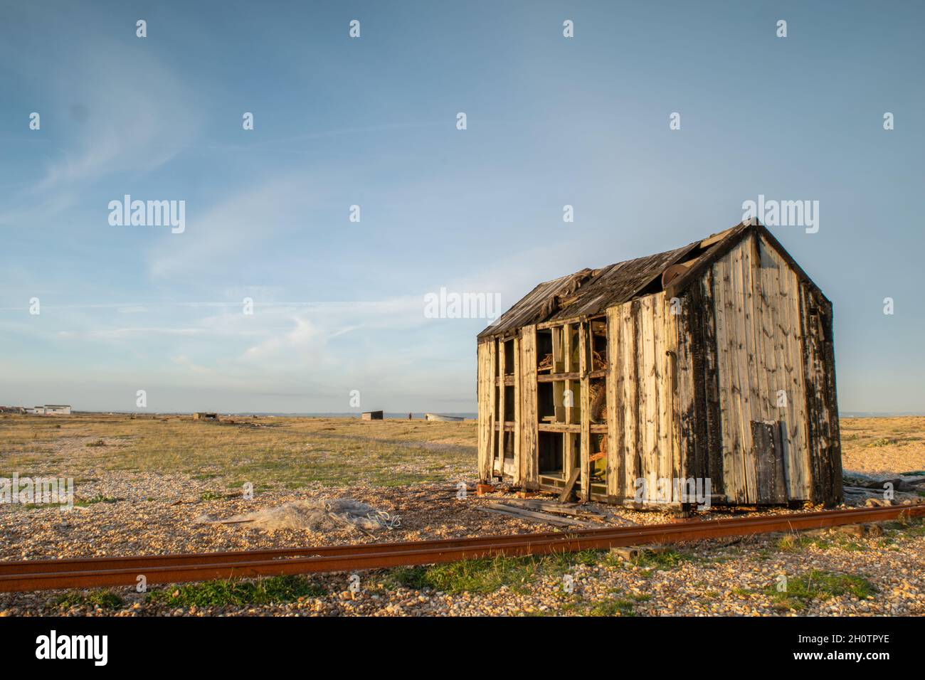 Abandoned and damaged wooden fishing shed at the beach of Dungeness ...