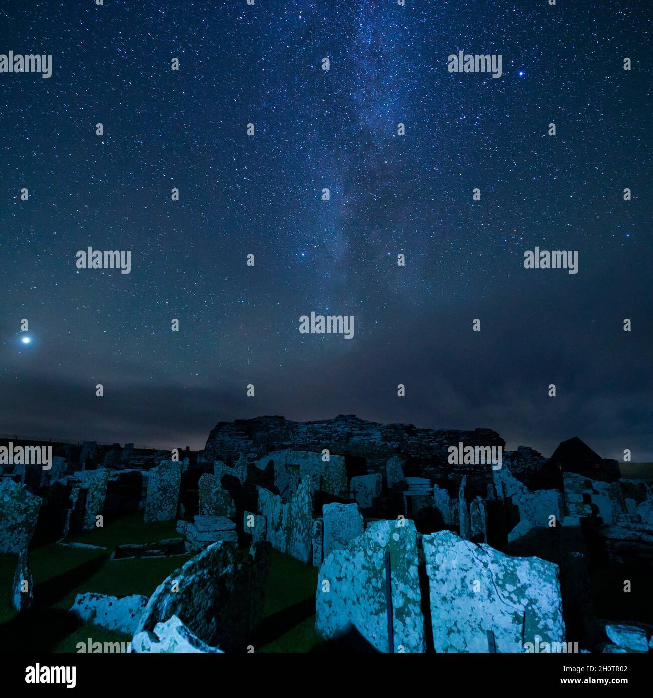 Broch of Gurness with Milky Way in night sky, Orkney Isles Stock Photo