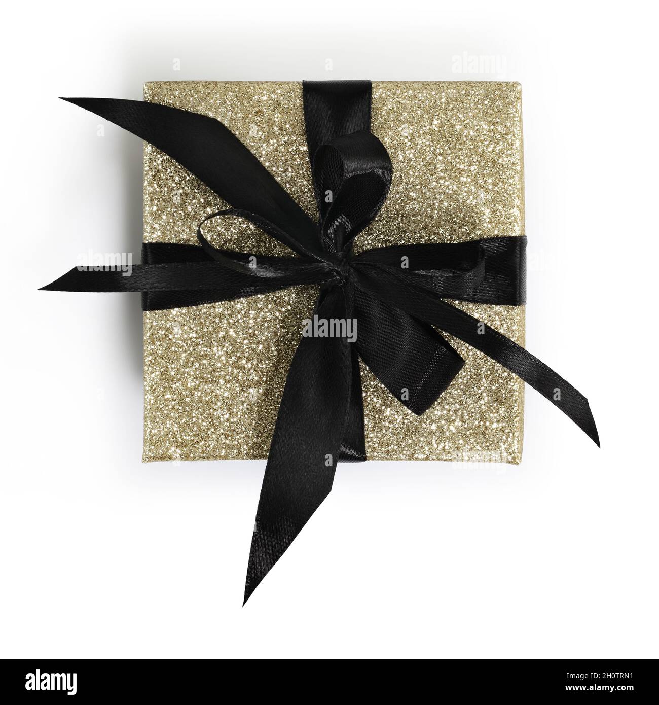 golden glittering gift box package with black ribbon bow isolated on