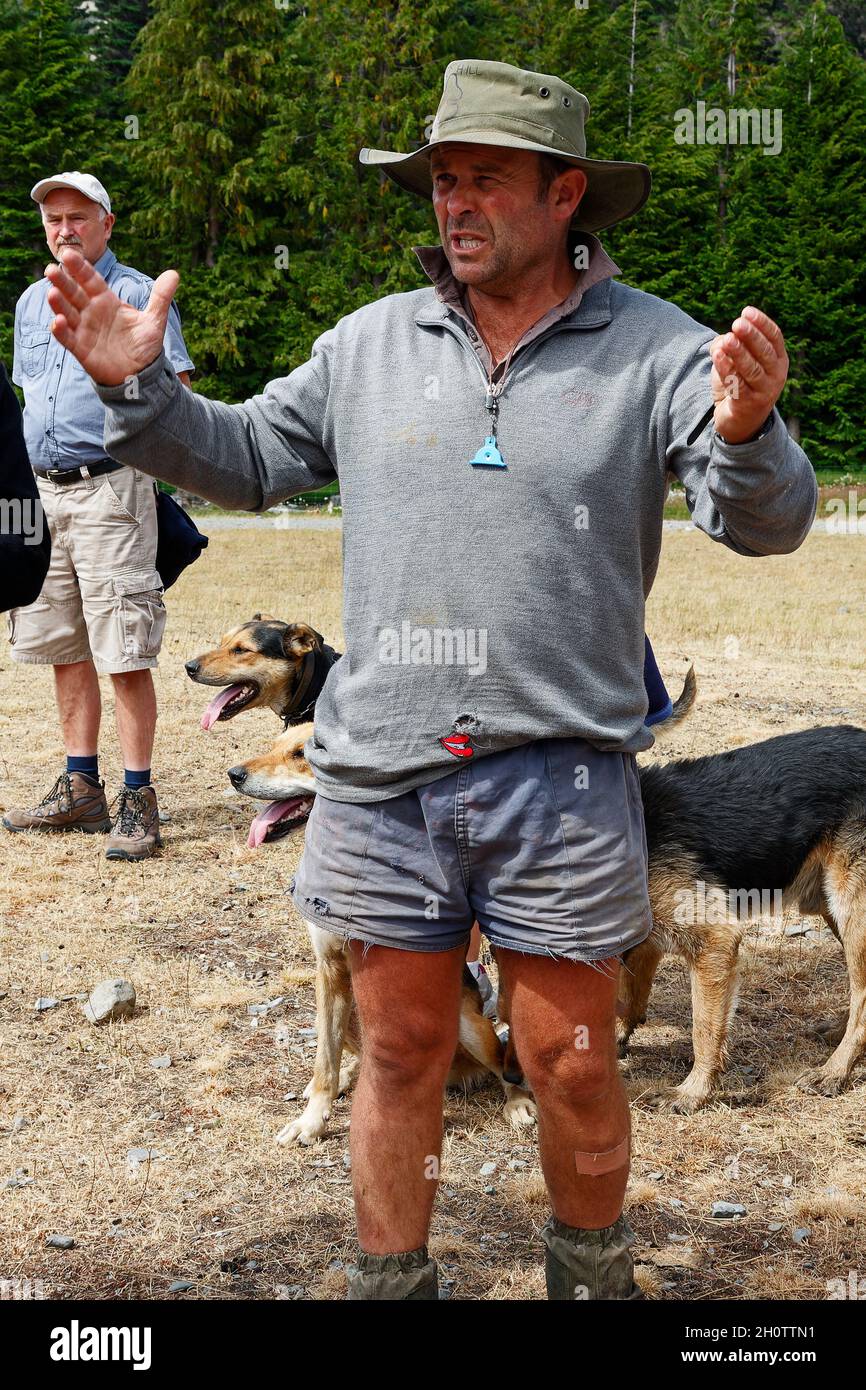 man explaining sheep station, rugged appearance, job, hands moving