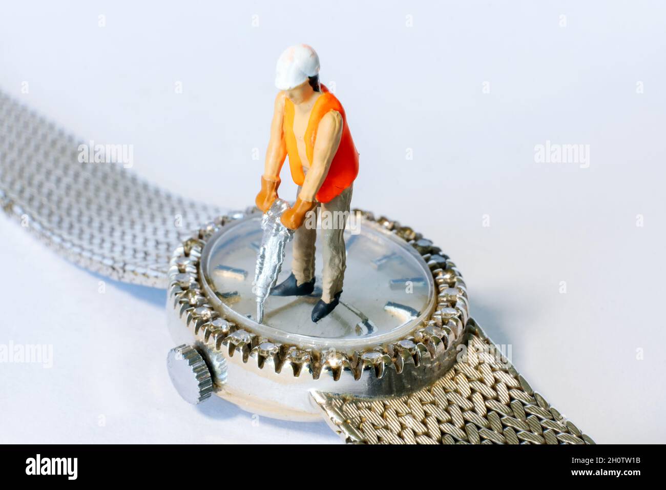 closeup of miniature people working on a diamond watch Stock Photo