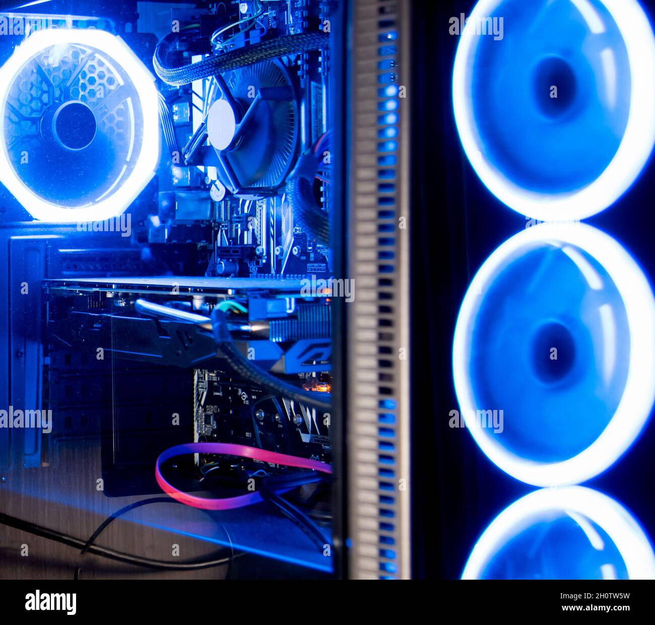 View of blue neon light of a pc case at night Stock Photo - Alamy