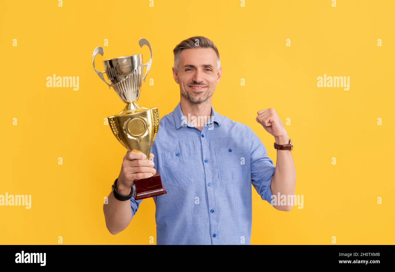 trophy and prestige. got prize. guy celebrate victory. inspiration and motivation. Stock Photo