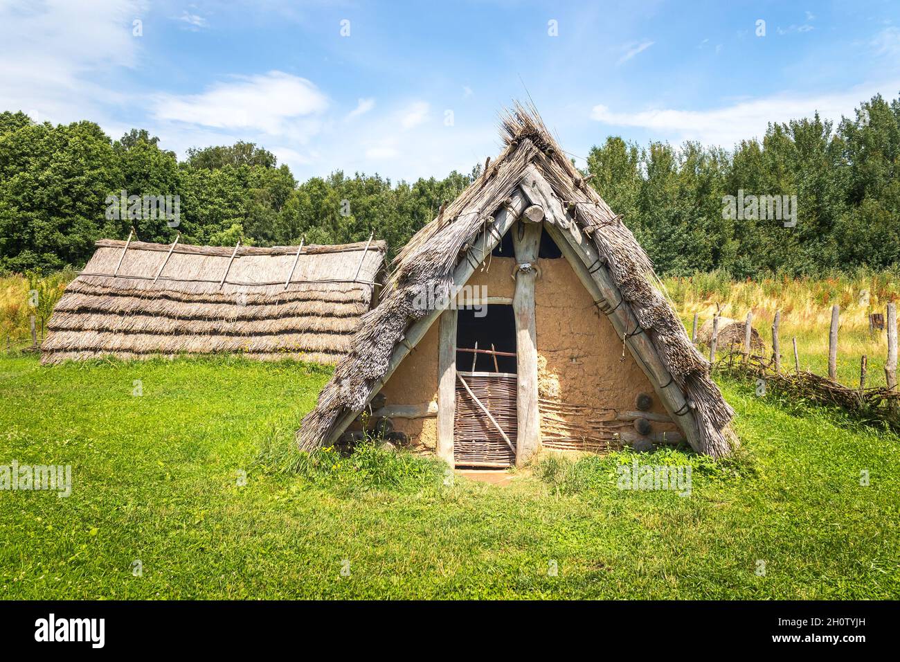 Celtic house with straw thatched roof at Celtic open air museum in