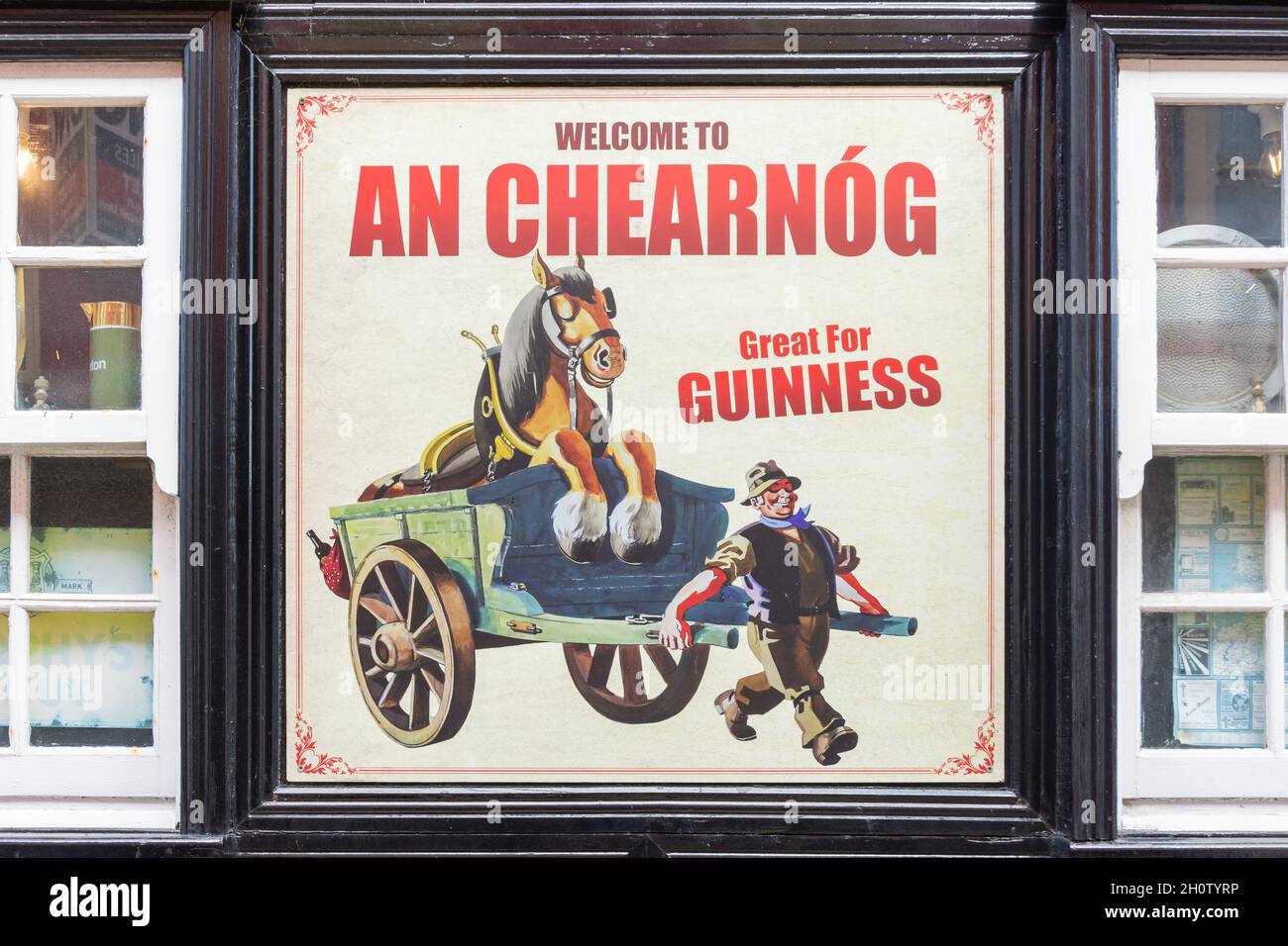 Retro Guinness advert on pub exterior, The Square Bar, The Square, Tralee (Tra Li), County Kerry, Republic of Ireland Stock Photo