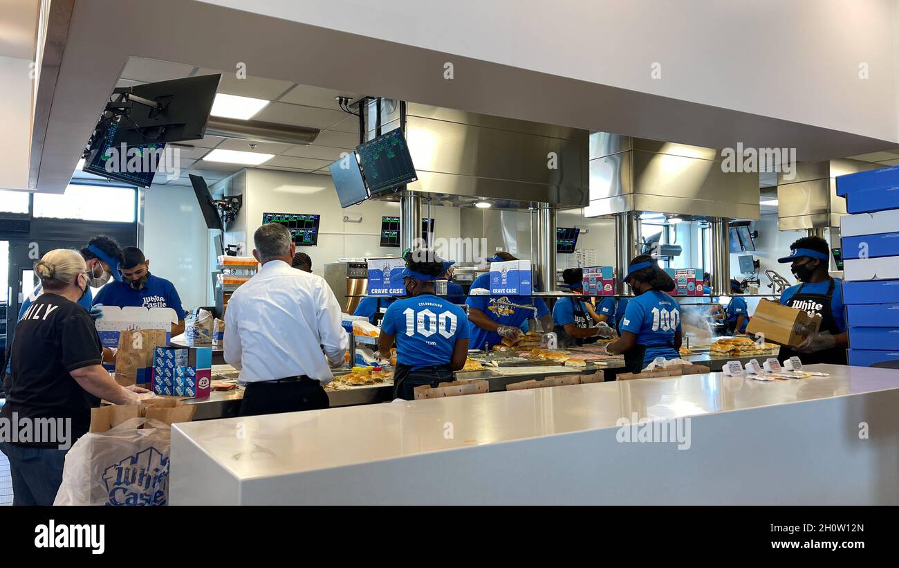 Orlando, FL USA -  June 8, 2021: The interior of a White Castle fast food restaurant with employees serving food in Orlando, Florida. Stock Photo