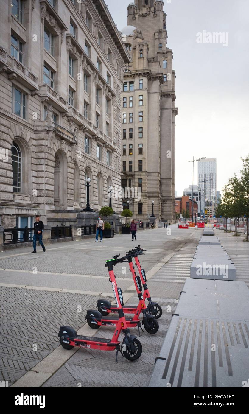 Hire electric Voi scooters parked near the Liver building in Liverpool Stock Photo Alamy