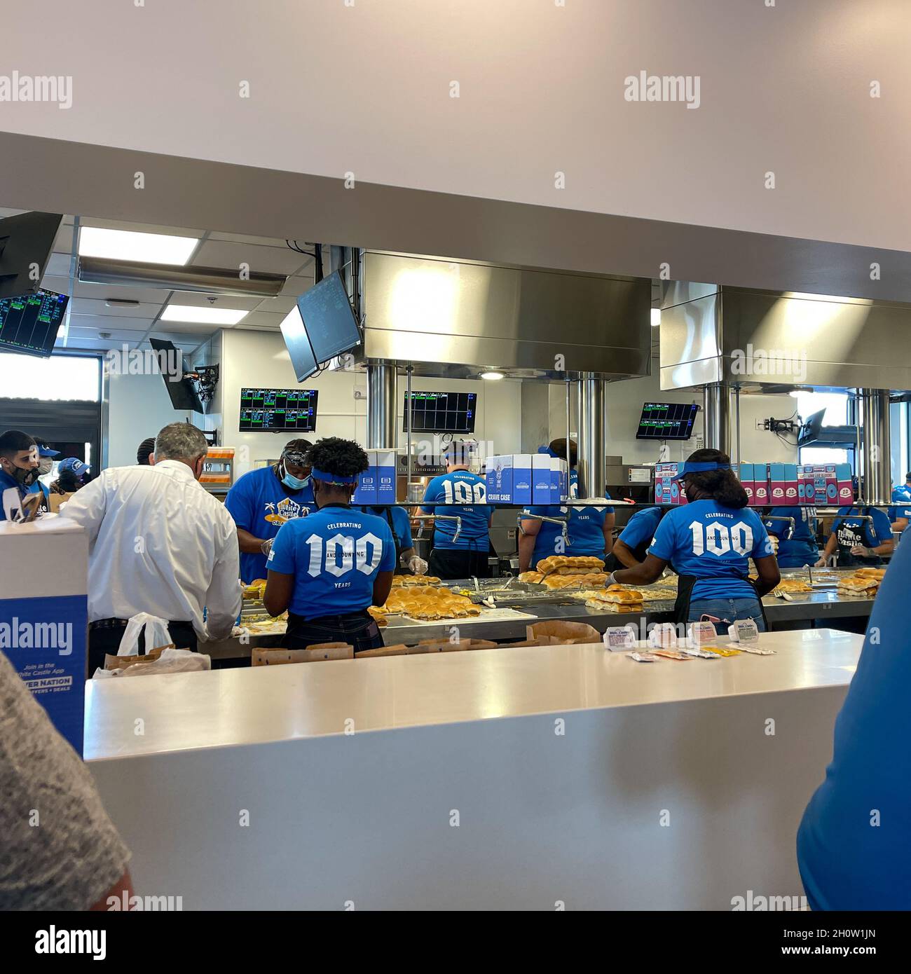 Orlando, FL USA -  June 8, 2021: The interior of a White Castle fast food restaurant with employees serving food in Orlando, Florida. Stock Photo