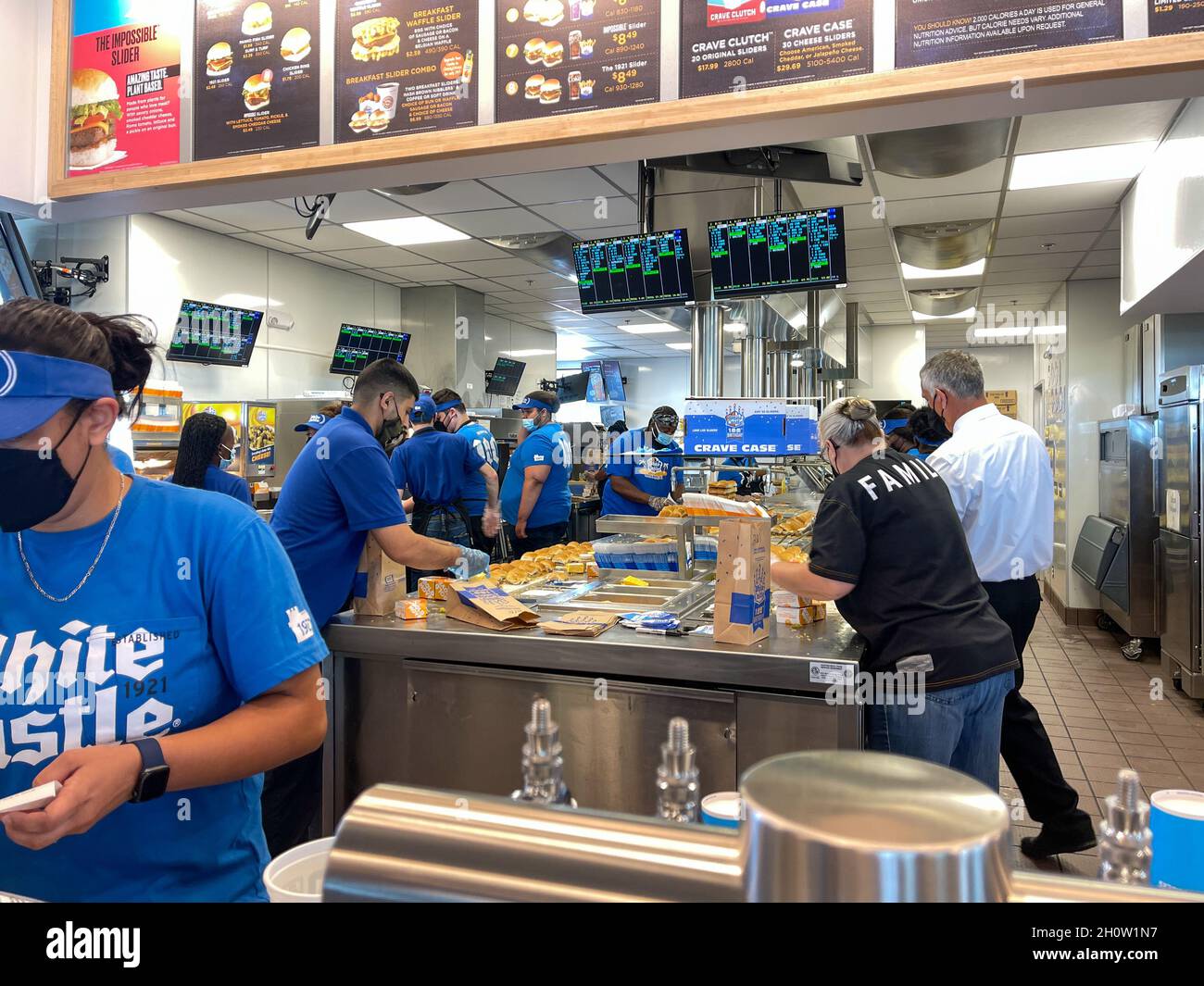 Orlando, FL USA -  June 8, 2021: The interior of a White Castle fast food restaurant with employees serving food in Orlando, Florida. Stock Photo