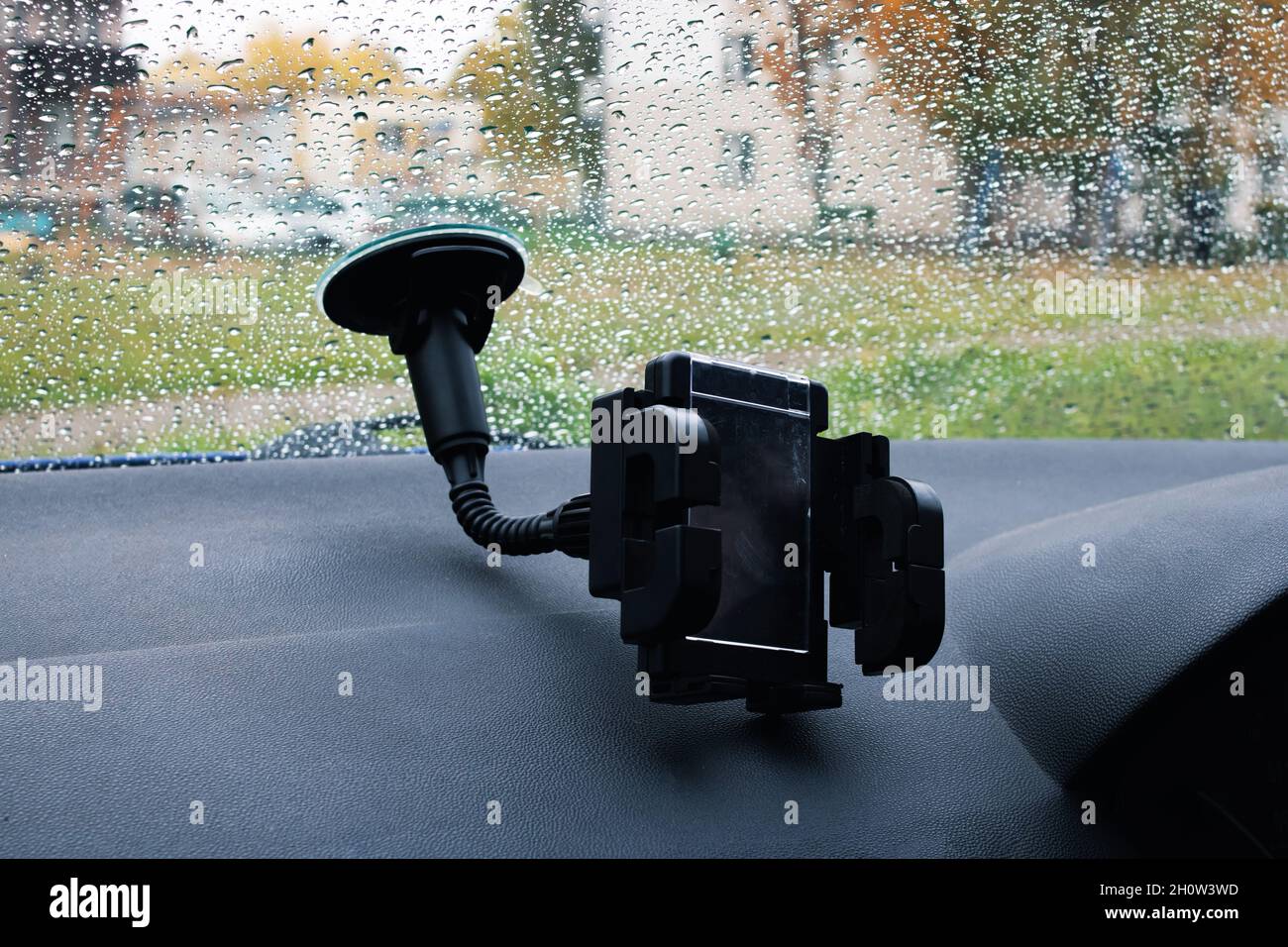 Car phone holder on a windshield close up Stock Photo
