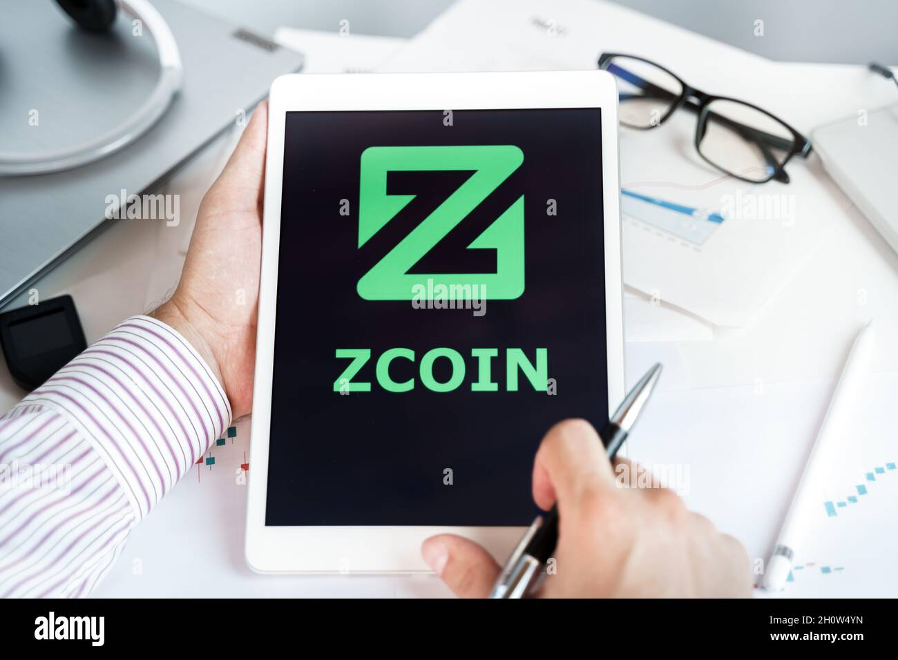 Moscow Russia 20.07.2021 Logo of Zcoin coin in mobile phone. Cryptocurrency XZC, Firo token. Trading blockchain platform to buy,sell on decentralized Stock Photo