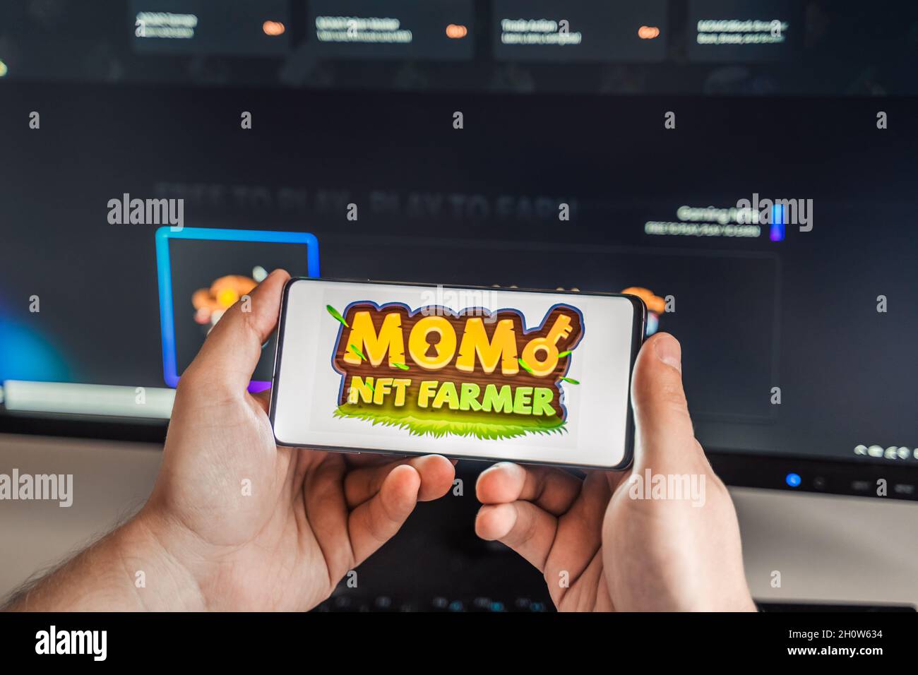 Russia Moscow 04.09.2021.Logo,screenshot of Mobox,Momo NFT Farmer, token  MBOX.Blockchain ethereum cryptocurrency game in laptop,mobile phone.Man  playi Stock Photo - Alamy