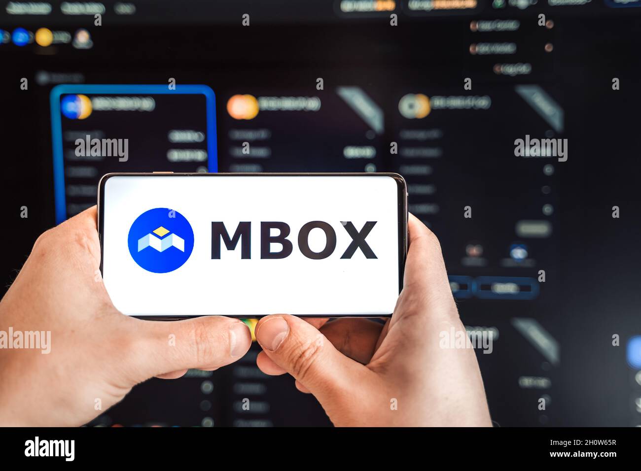 Russia Moscow 04.09.2021.Logo,screenshot of Mobox,Momo NFT Farmer, token  MBOX.Blockchain ethereum cryptocurrency game in laptop,mobile phone.Man  playi Stock Photo - Alamy