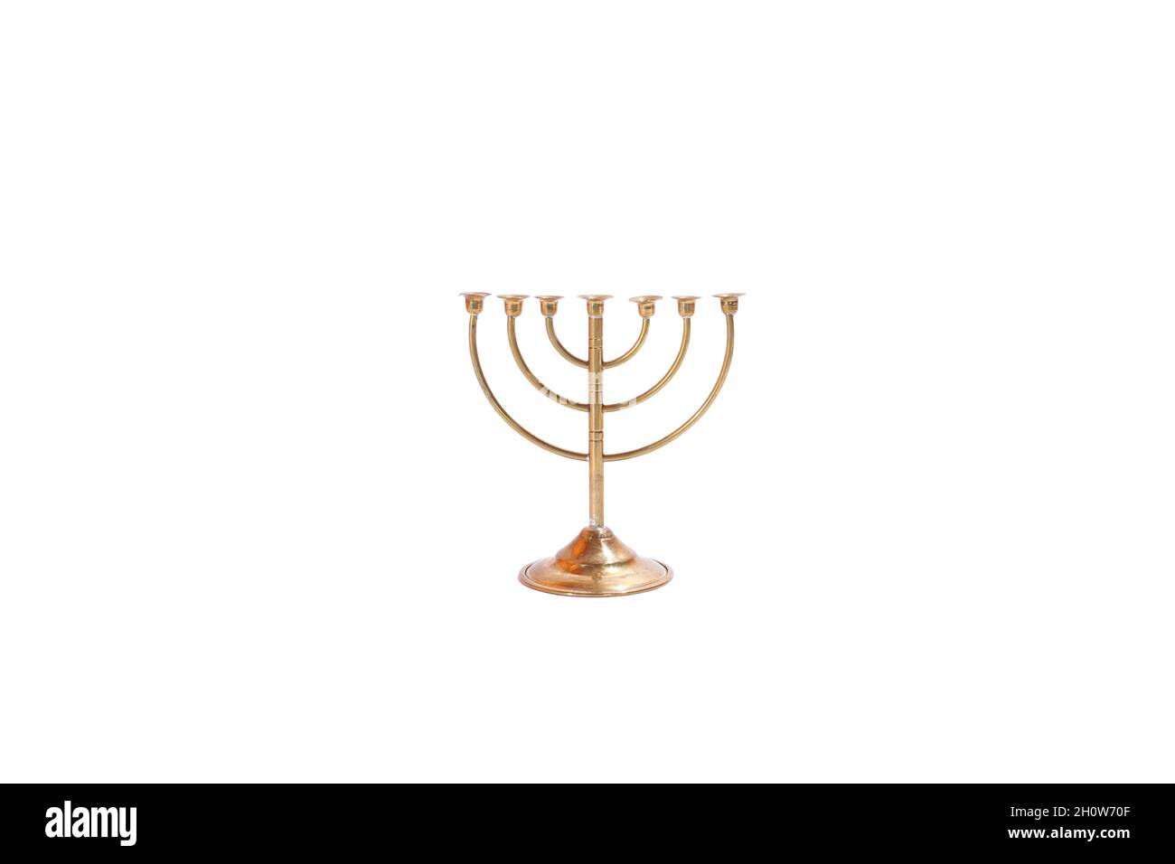Golden 7-arm candlestick, isolated on white background. Menorah, Judaic, metal, Judaism. Stock Photo