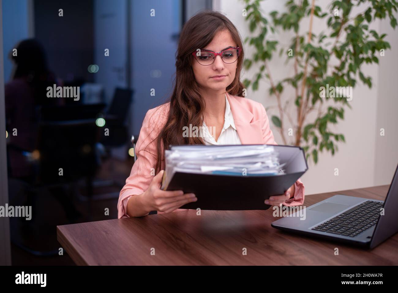 Young business holding binder with business paper Stock Photo