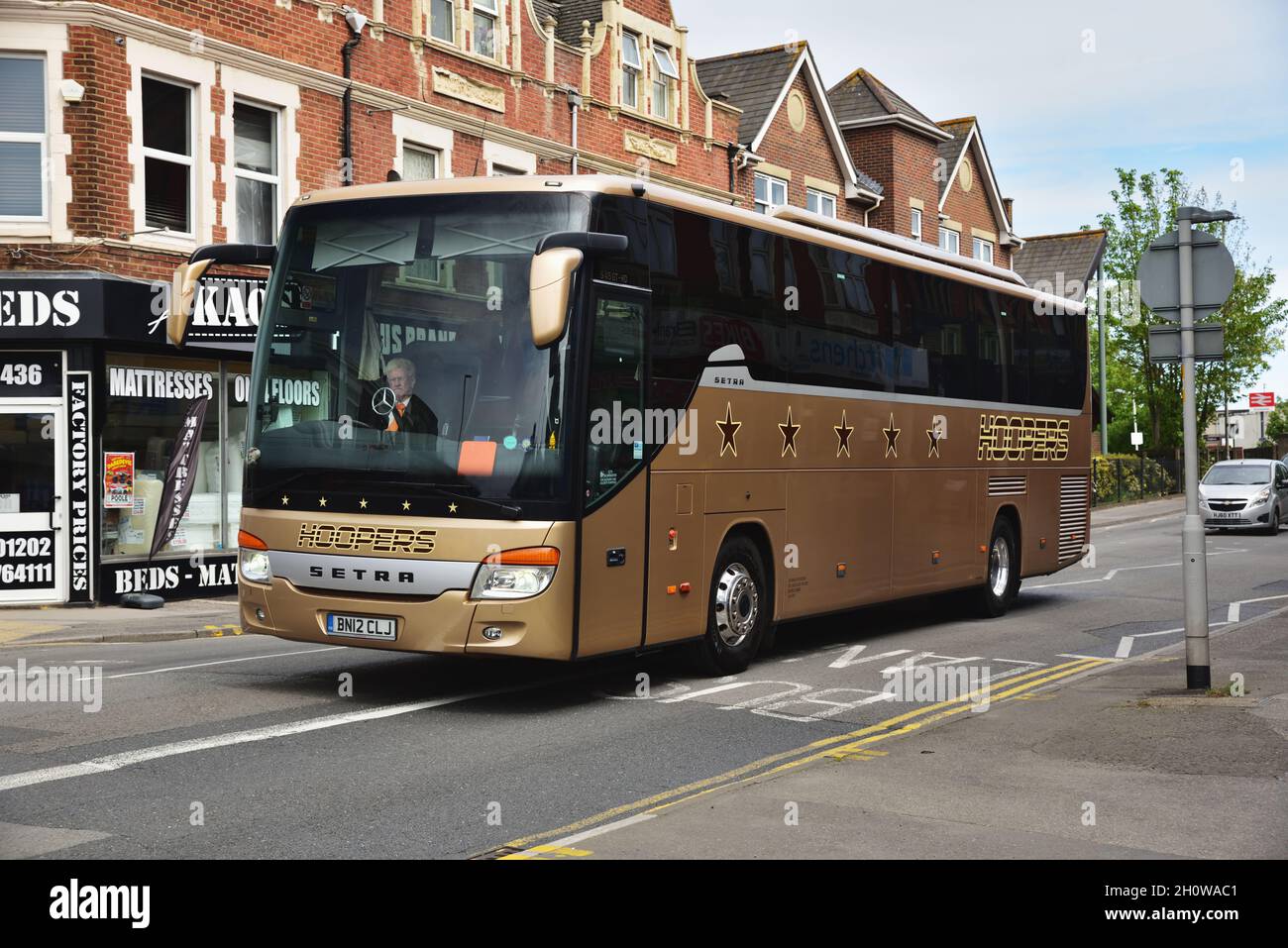 Howard Hooper Coaches of Morecambe Setra S415GT-HD BN12 CLJ is seen passing Branksome in Poole, Dorset. The vehicle was new to C & J Tours, Chelmsford Stock Photo