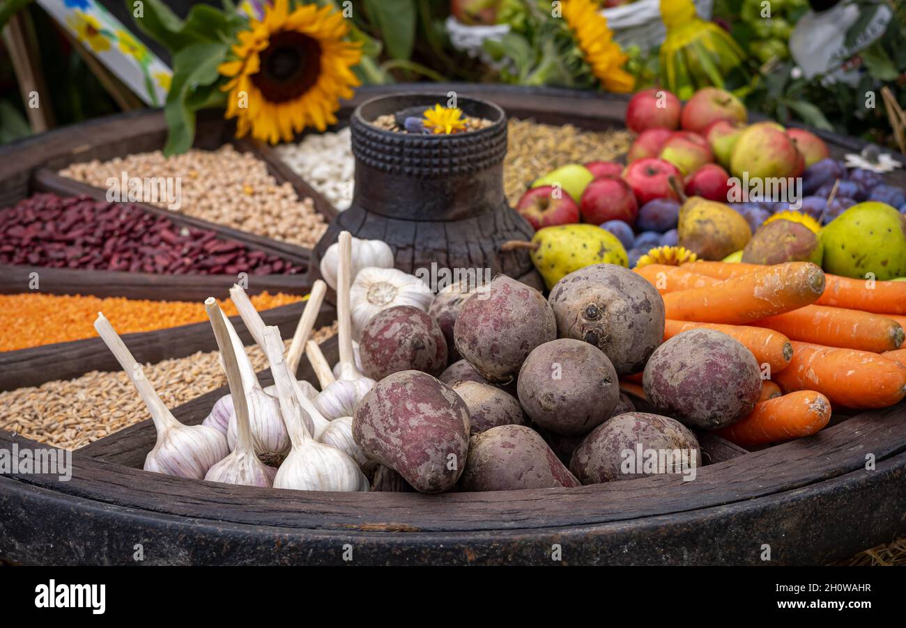Colorful selection of fruits and vegetables in an old wooden carriage