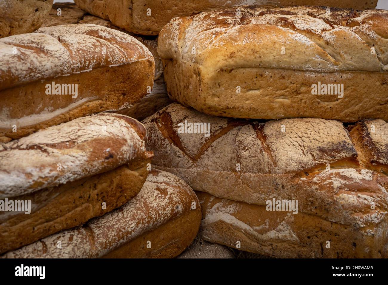 A pile of loaves of fresh artisan bread Stock Photo - Alamy