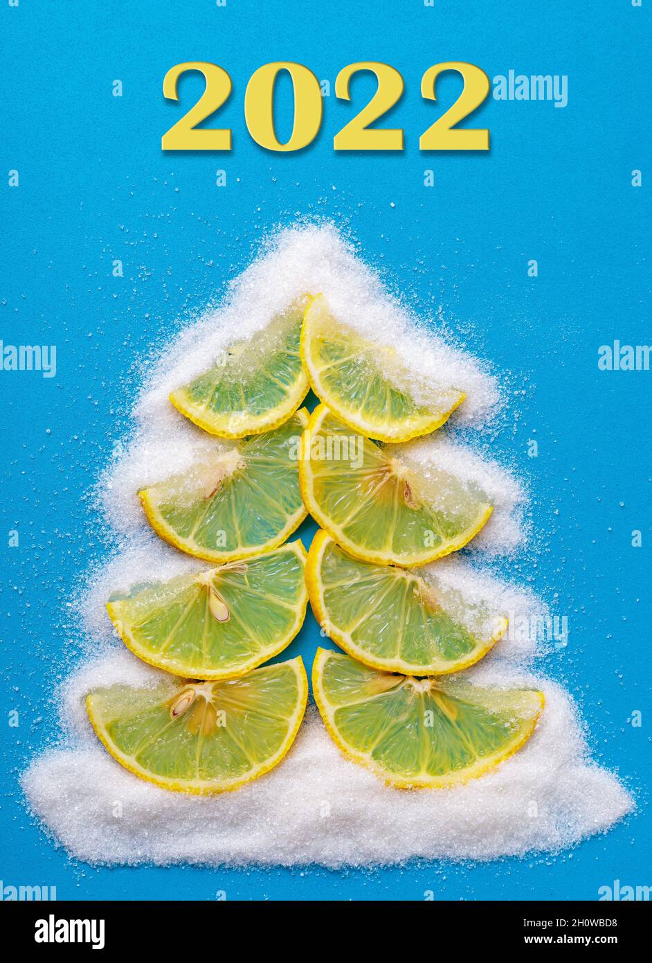 Christmas tree made from lemon and sugar fruits on a blue background Stock Photo Alamy