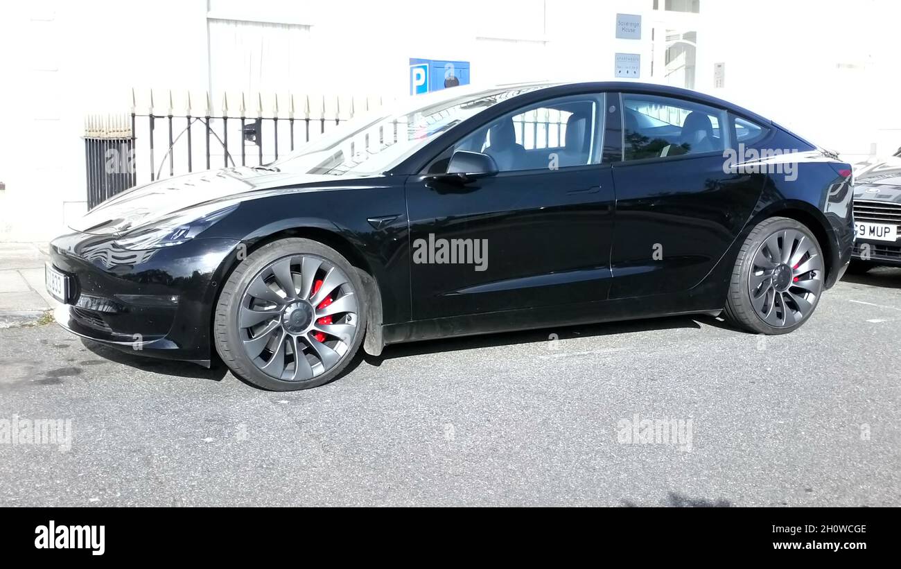 A black 2021 registered Tesla Model 3 dual motor electric powered