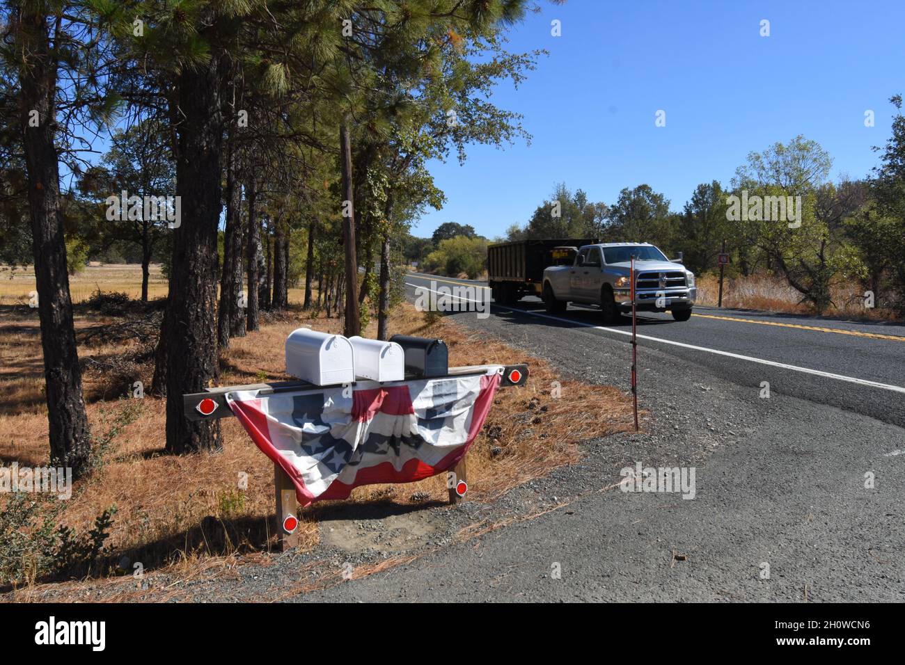 Rural private mail boxes draped with flags around July 4th Stock Photo