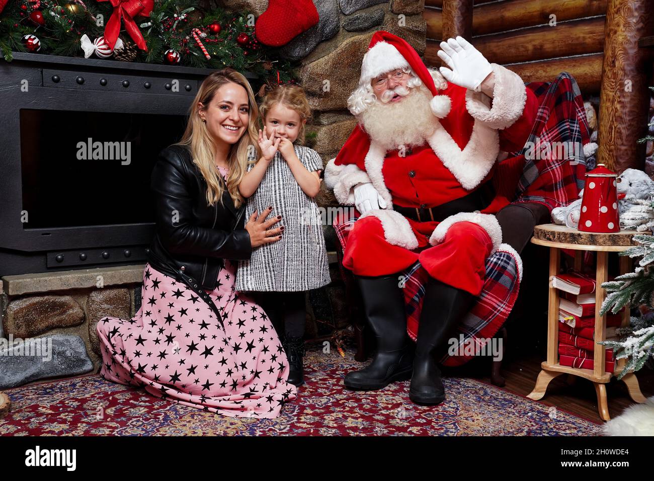 Fleur DeForce and her daughter River sit in the grotto with Santa Claus