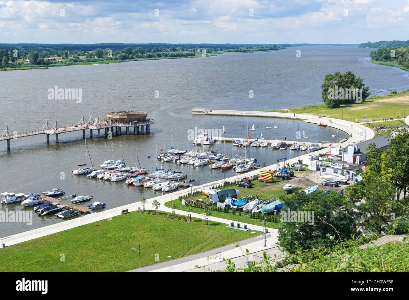 Pier and boats in marina on the Vistula River in Plock, Poland Stock Photo