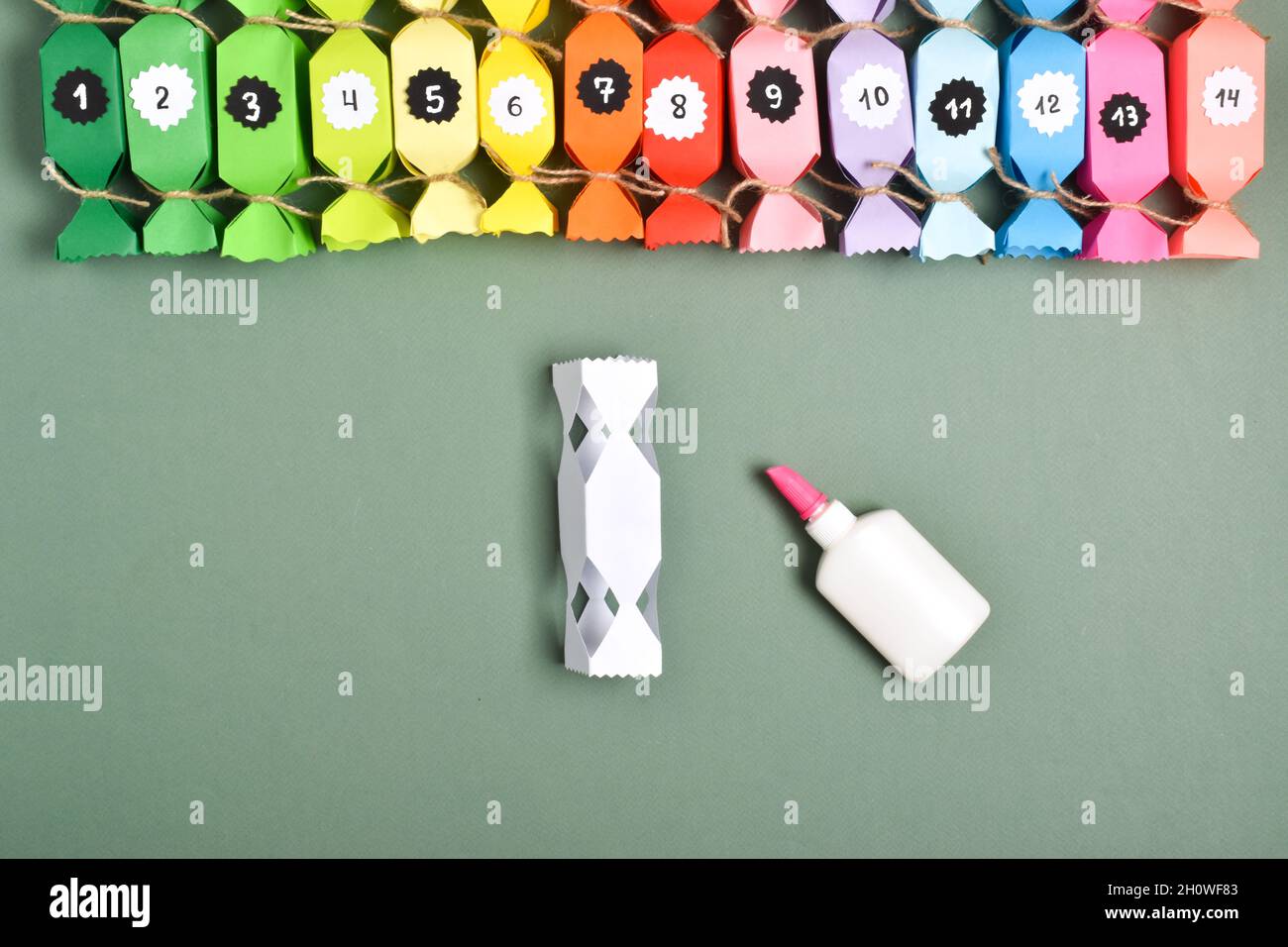 DO IT YOURSELF. Advent calendars made of colored paper in the shape of  sweets. Step-by-step instructions. Step 10. We glue them together Stock  Photo - Alamy